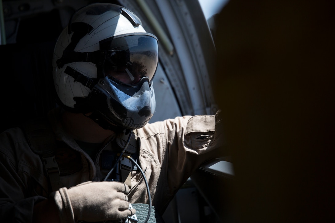 Lance Cpl. John Buckly, a CH-46E Sea Knight helicopter crew chief with Marine Medium Helicopter Squadron 774, 4th Marine Aircraft Wing, Marine Forces Reserve, looks out for obstacles during an area familiarization flight as a part of Integrated Training Exercise 4-14 here June 7, 2014. The flight operation was the first during ITX 4-14, a two-week exercise and the first time for the pilots flying in a desert environment since last year’s ITX. ITX is the largest Marine Corps Reserve training exercise with more than 4,000 Marines and sailors participating from units across the United States. The exercise focuses on the tactical application of combined-arms during global contingencies.