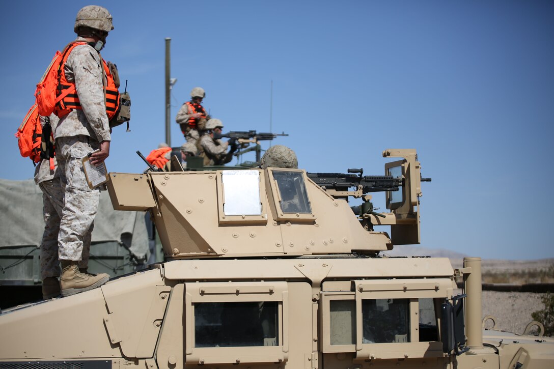 Marines from Combat Logistics Battalion 451 fire down range with a M240B machine gun on long distance targets in a motorized operations training exercise at Marine Corps Air-Ground Combat Center Twentynine Palms, California, during Integrated Training Exercise 4-14 on June 8, 2014. ITX 4-14 is a cornerstone of the Marine Air-Ground Task Force Training Program and is the largest annual Marine Corps Reserve training exercise that helps sharpen skills and planning guidance for Reserve units. ITX employs assets from ground, air and logistics combat elements to demonstrate the ability to deploy rapidly and build up significant combat power necessary to form a MAGTF.
