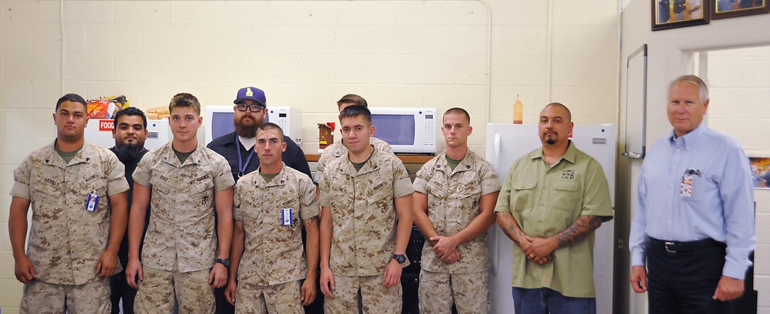 Marines from Combat Logistics Battalion 3, Combat Logistics Regiment, 3d Marine Logistics Group, III Marine Expeditionary Force, pose for a group shot
with Arthur Gutierrez, hydraulics system mechanic on Production Plant Barstow, Marine Depot Maintenance Command, Marine Corps Logistics Base
Barstow, Calif., Luke Wirick, heavy mobile equipment mechanic, Anthony Sanchez, hydraulics shop supervisor, and Ed Shimko, plant manager at PPB,
after receiving certifications for filling, discharging and testing automatic fire suppression systems (AFSS). Mechanics with the hydraulics shop here
ensured they were getting the training they needed to successfully and safely take the newly acquired skills and knowledge back to Hawaii.