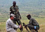 Burundi National Defense soldiers practice mortar man skills here, April 3,2012, with Texas Army National Guard Sgt. Tommy Cummings, Task Force Raptor, 3rd Squadron, 124th Cavalry Regiment. The Guard members conduct various military-to-military exchanges in support of Combined Joint Task Force - Horn of Africa to build partnerships with nations in East Africa.