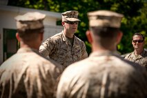 A Marine at Quantico addresses employees from the Program and Resources Office at Headquarters Marine Corps. Employees from P&R visited Quantico June 6, to better understand how their work impacts Marines in the fleet. 