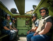 A civilian Marine who works in the Program and Resources Office at Headquarters Marine Corps sits in a light armored vehicle at Marine Corps Base Quantico. Employees from P&R visited Quantico June 6, to better understand how their work impacts Marines in the fleet. 