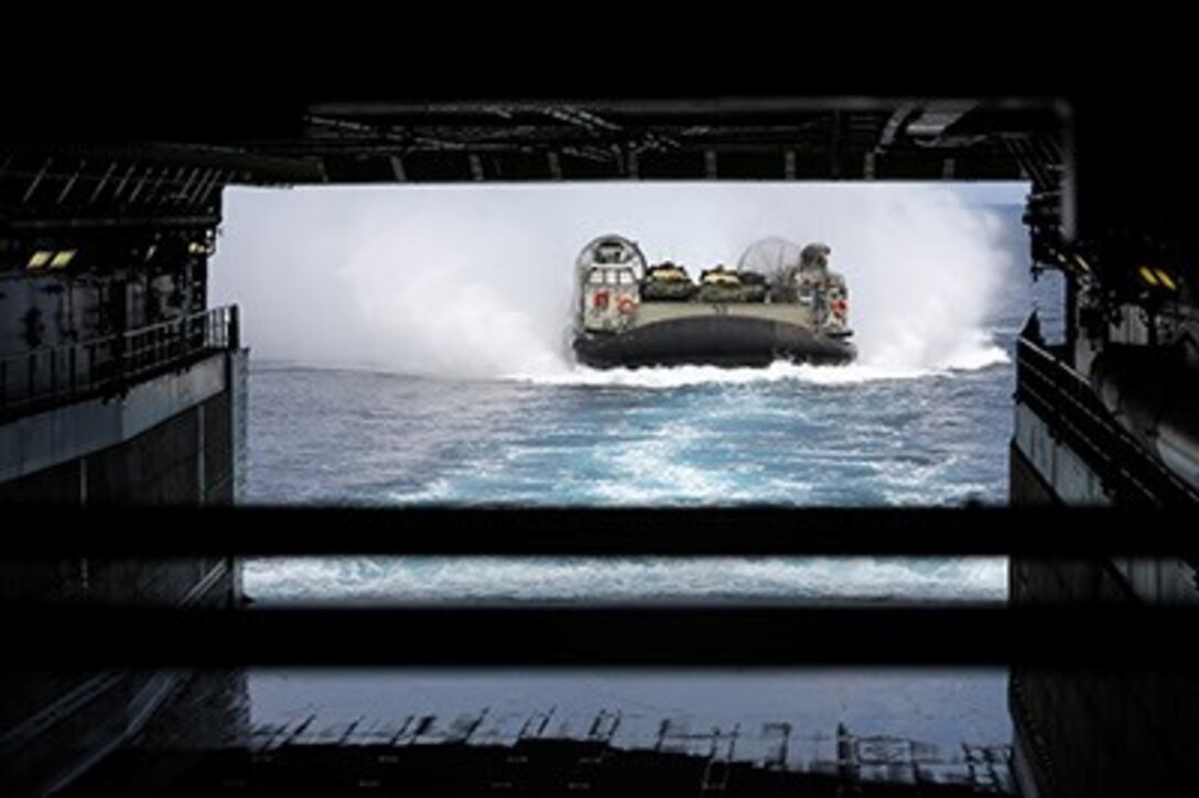 A landing craft air cushion (LCAC) from Assault Craft Unit 5, Amphibious Squadron (PHIBRON) 5, approaches the well deck of the USS San Diego during the initial on-load for Certification Exercise (CERTEX) off the coast of San Diego, , June 10, 2014. CERTEX serves as the final at-sea period for the 11th MEU and PHIBRON 5. It is designed to strengthen the blue-green team's ability to operate together and to respond to various situations while deployed. (U.S. Marine Corps photo by Cpl. Jonathan R. Waldman/RELEASED)