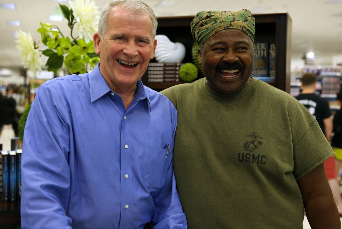 CAMP PENDLETON, Calif. - Oliver North, a retired Marine Corps colonel, meets retired Marine Lt. Col. Ken Graham at the Pacific Views Marine Corps Exchange here June 7.

Pendleton is among the first stops for North as part of his book promotion tour where he will travel across the country making more than 40 stops.  North said it was an easy decision to make Pendleton an early stop because "it is all about the Marines."

North is a best-selling author and host of the TV show War Stories. Graham served in the Marine Corps during the same time as North.