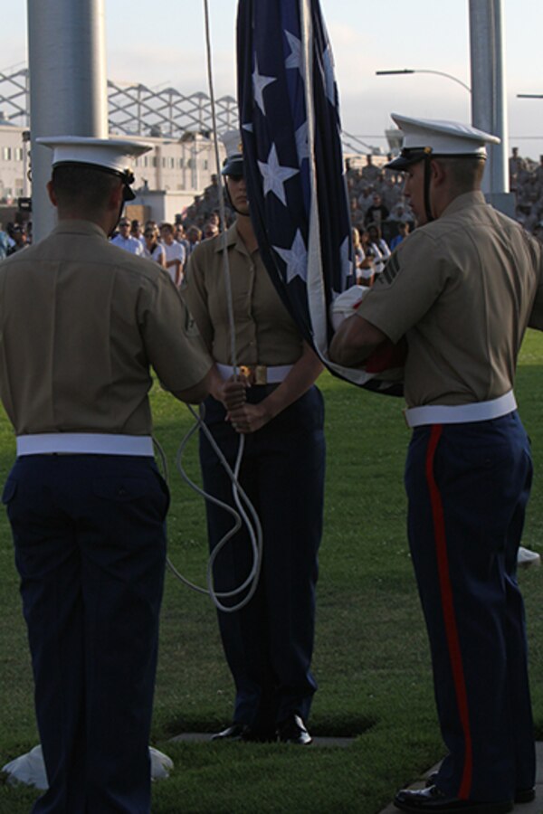 Marines retire the colors during an evening colors ceremony aboard Marine Corps Air Station Miramar, Calif., June 10. The ceremony recognized the San Diego Chargers for their service to military members in surrounding communities. The event featured 3rd Marine Aircraft Wing and MCAS Miramar noncommissioned officers as part of the Committed and Engaged Leadership initiative, originated by Maj. Gen. Steven Busby, 3rd MAW commanding general.