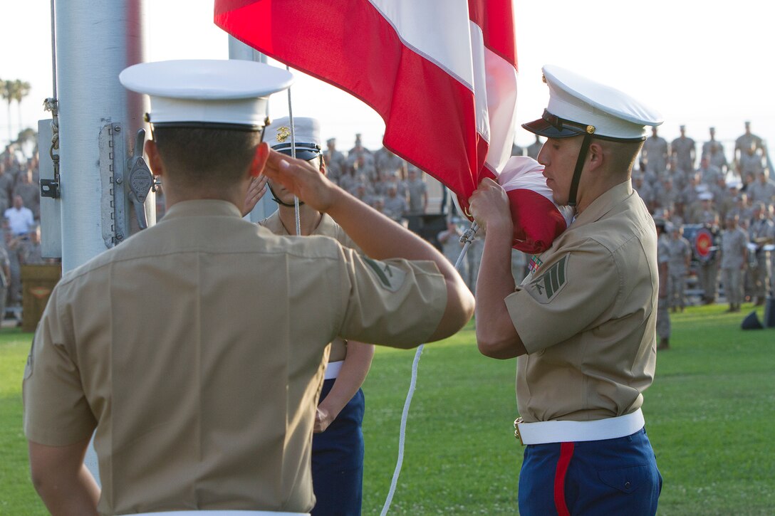 Marines retire the colors during an evening colors ceremony aboard Marine Corps Air Station Miramar, Calif., June 10. The ceremony recognized the San Diego Chargers for their service to military members in surrounding communities. The ceremony featured 3rd Marine Aircraft Wing and MCAS Miramar noncommissioned officers as part of the Committed and Engaged Leadership initiative, originated by Maj. Gen. Steven Busby, 3rd MAW commanding general.