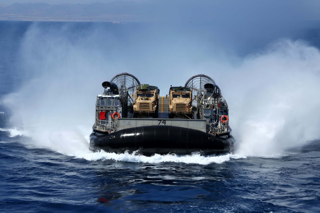 A landing craft air cushion maneuvers toward the USS Makin Island during Certification Exercise off the coast of southern California, June 10, 2014. Excercise serves as the final at-sea period for the 11th MEU and Amphibious Squadron 5. It is designed to strengthen the Navy and Marine Corps' ability to operate together and respond to various situations while deployed. (U.S. Marine Corps photo by Lance Cpl. Laura Y Raga/Released)
