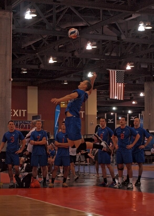 1st Lt. Jonathan Fullenkamp, #9, jump serves for the 2014 All-Air Force Men's Volleyball team during the USA Volleyball Open National Championships in Phoenix, Ariz., May 27. The Air Force Men’s Volleyball team finished 3-3 in their pool against the Navy, Army and three other open teams and they finished in 19th place out of 31 teams overall. Fullenkamp is an Air Force Research Laboratory, Detachment 7, Advanced Tactical Booster Demonstration deputy program manager.  Fullenkamp also coached the junior varsity girls team at Lancaster High School for the past three years. (Photo by Lance Spott)