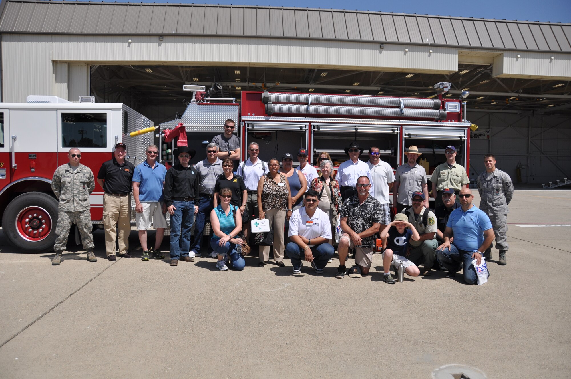Employers, local civic leaders, and two reservist firefighter break from an Employers Support of the Guard and Reserve Employer Day tour, June 8, 2014, for a group photo. The tour provided some employers from the communities surrounding Beale Air Force Base, Calif., an opportunity to learn about the wing’s mission and join reservists and family members at the wing’s annual picnic. (U.S. Air Force photo/Tech. Sgt. Heather Skinkle)