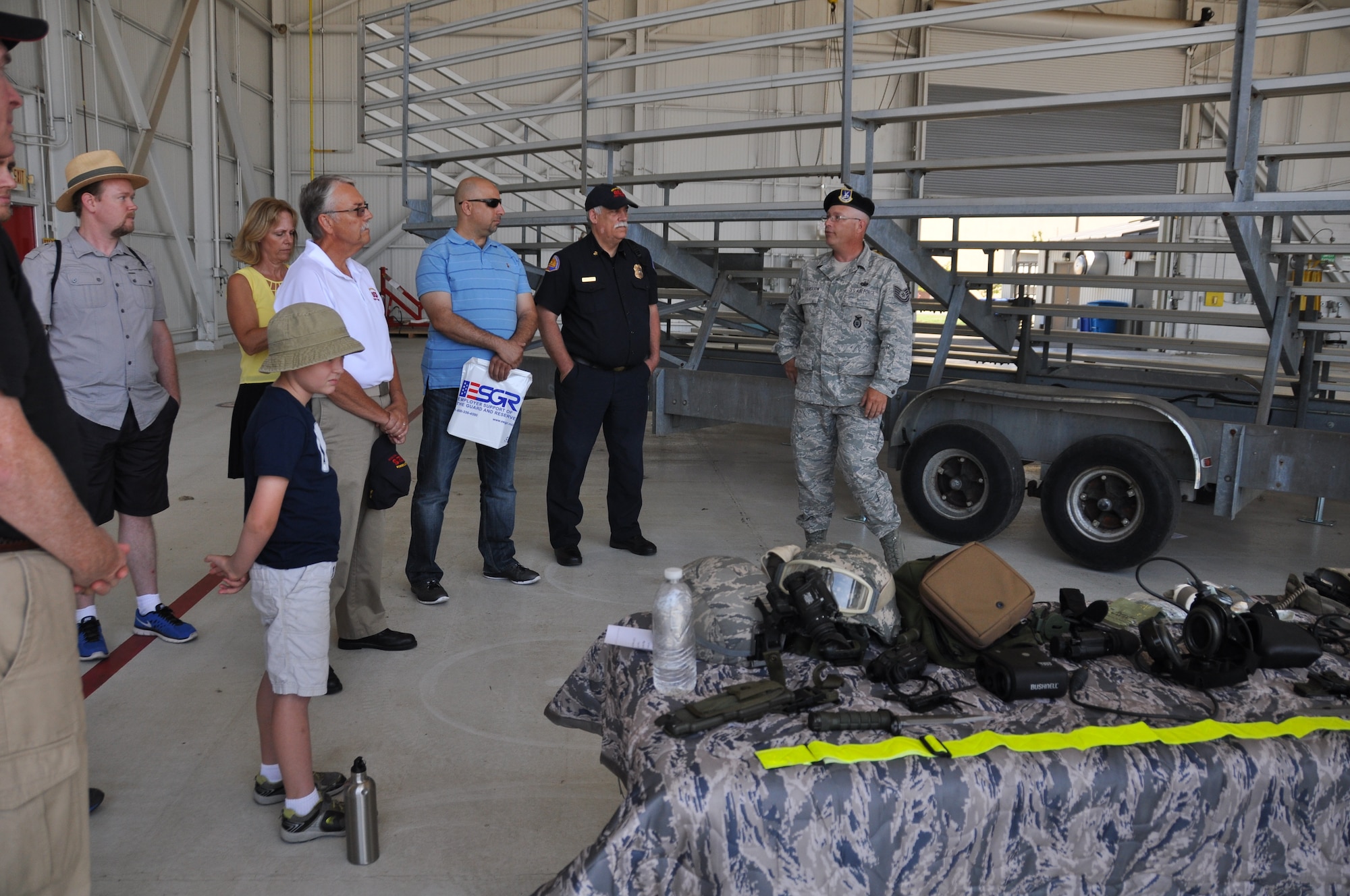 Tech. Sgt. John Furgerson, 940th Security Forces Squadron combat arms instructor, explains to employers and local civic leaders about weapons and equipment used to support the wing at the annual Employer Support of the Guard and Reserve Employer Day tour, June 8, 2014. The tour provided employers from the local communities around Beale Air Force Base, Calif., an opportunity to learn about the wing’s mission and join reservists and family members at the wing’s annual picnic. (U.S. Air Force photo/Tech. Sgt. Heather Skinkle)