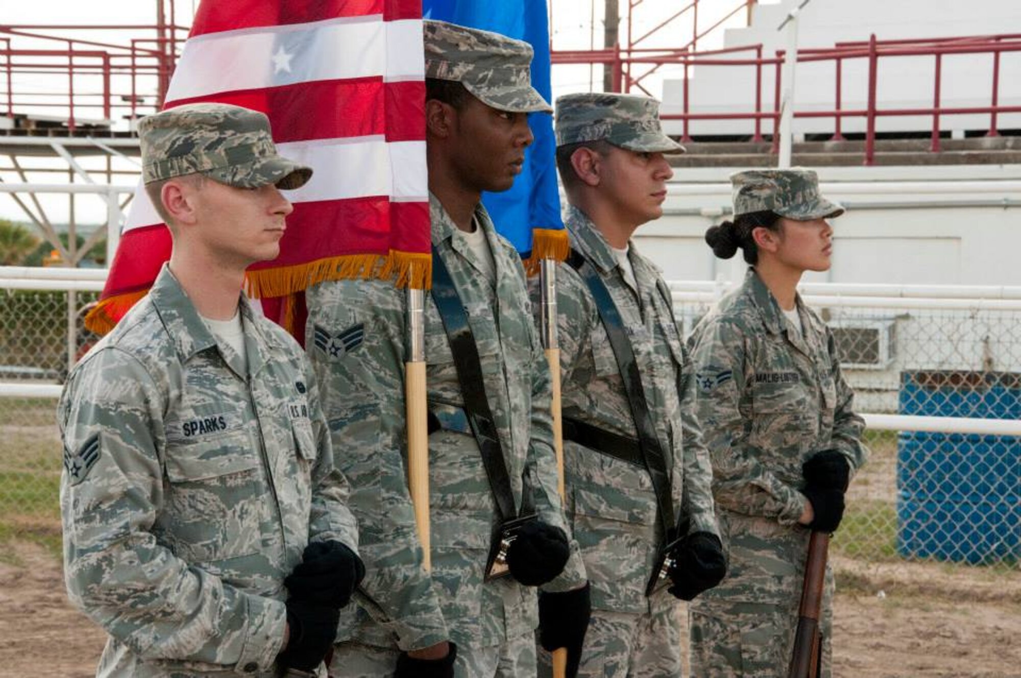 From left, Senior Airman Cody Sparks, Senior Airman Lewis Adaultha, Airman 1st Class Jesse Garcia Villanueva and Airman 1st Class Kristin Malig-Listisen, all members of the Laughlin Honor Guard, perform a flag detail for a flag retirement ceremony at the Val Verde County Fairgrounds in Del Rio, Texas, Sept. 11, 2013. The Benevolent and Protective Order of Elks hosted the event, where old U.S. flags, too tattered to be flown, were properly destroyed. (U.S. Air Force photo by Senior Airman Nathan Maysonet, 47th Flying Training Wing)(Released) 