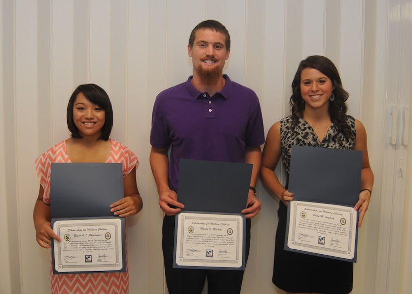 Elizabeth Richardson, Charles Mitchell and Haley Hogberg hold their award certificates for winning the Fairchild edition of Scholarships for Military Children at Fairchild Air Force Base, Wash., June 11, 2014. The Fisher House-sponsored award is a $2,000 scholarship for graduating high school seniors and students currently enrolled in a four-year program. A minimum 3.0 grade point average and demonstration of community involvement are among the requirements for consideration. (U.S. Air Force photo by Airman 1st Class Sam Fogleman/Released)
