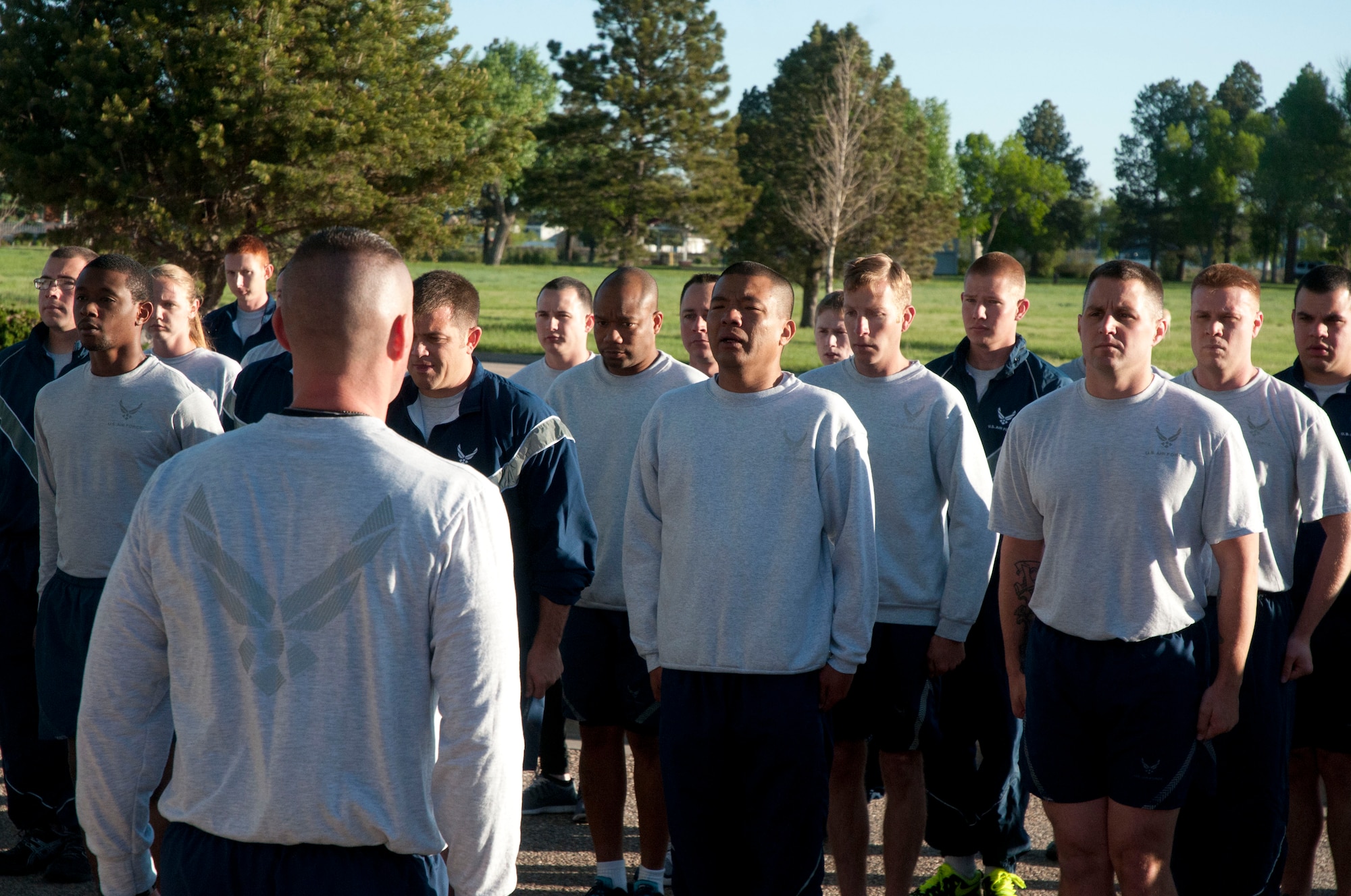 The 90th Logistics Squadron forms up for the end of their memorial run June 10, 2014, which memorialized Airman 1st Class Eric Barnes, an Airman who died on June 10, 2007, from a roadside bomb during a tour in Iraq. Lead by Master Sgt. Ricardo Borecki, 90th LRS first sergeant, the squadron run went from the Freedom Hall Fitness Center to the Contracting Squadron and back. (U.S. Air Force photo by Airman Malcolm Mayfield)