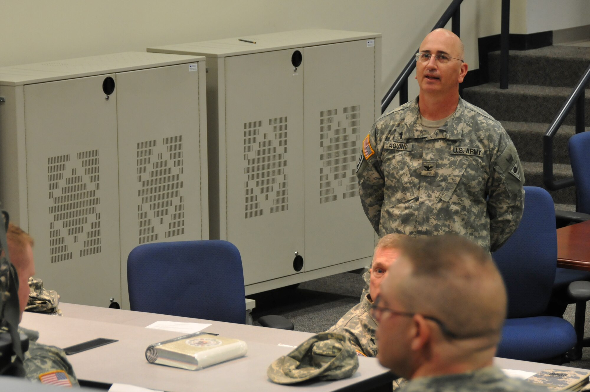 Army Col. Andrew W. Aquino speaks to a group of chaplains as the Ohio National Guard is holding the chaplains quarterly gathering at the 179th Airlift Wing, May 3, 2014, Mansfield, OH. Chaplains and chaplain assistants from both the Ohio Army National Guard and Ohio Air National Guard are attending.(U.S. Air National Guard Photo by TSgt Joseph Harwood \Released)