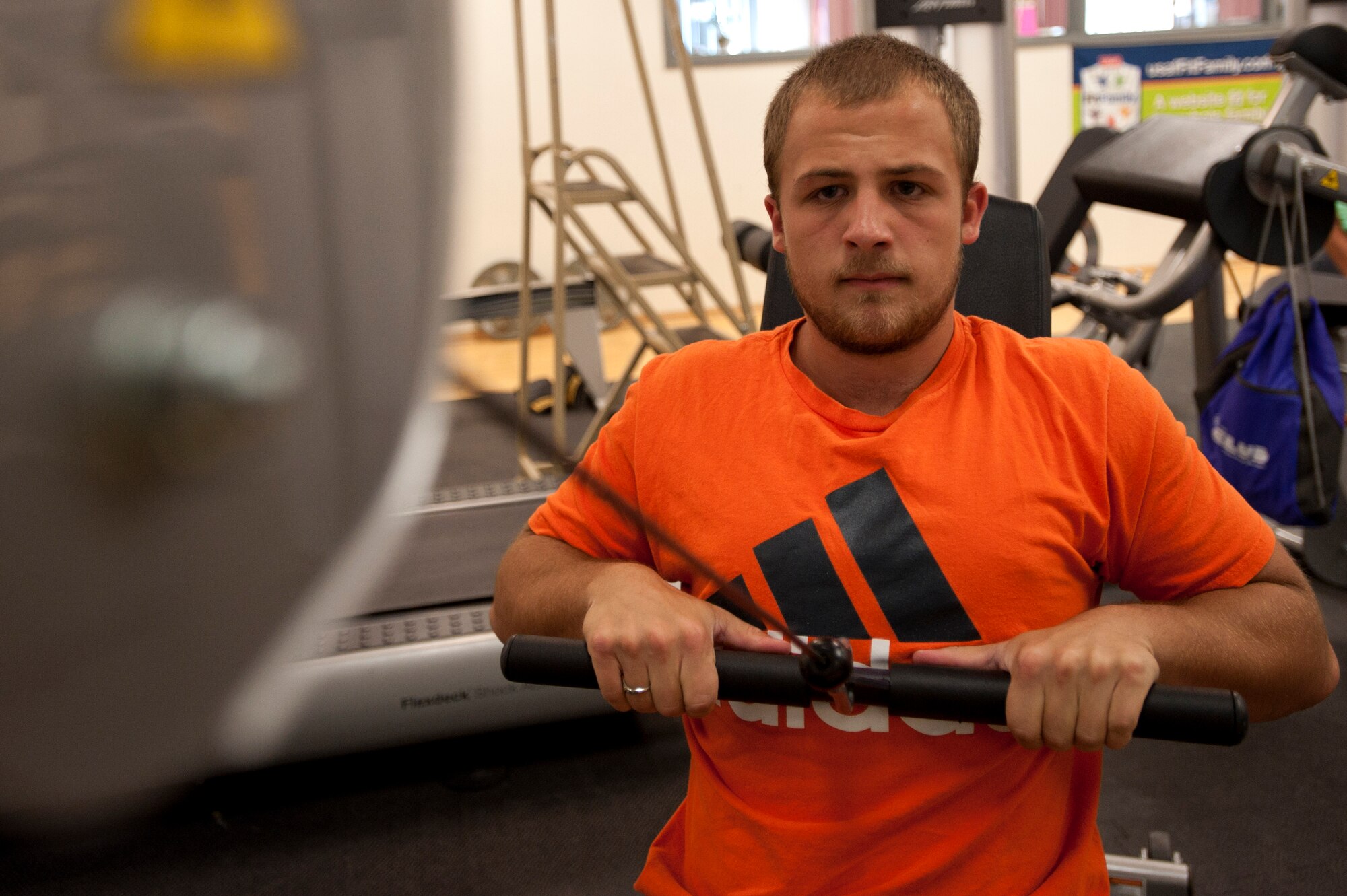 Hunter works out on gym equipment at the 99th Force Support Squadron Youth Center June 5, 2014, at Nellis Air Force Base, Nev. A variety of workout equipment is housed at the youth center for use by teenagers. (U.S. Air Force photo by Senior Airman Timothy Young)