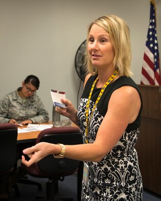 Erin Locke, 23d Medical Group health promotion dietician, teaches a weight management class at Moody Air Force Base, Ga., June 2, 2014. Locke teaches many classes on weight management and healthy eating, and also hosts commissary tours and cooking demonstrations. (U.S. Air Force photo by Senior Airman Jarrod Grammel/Released) 
