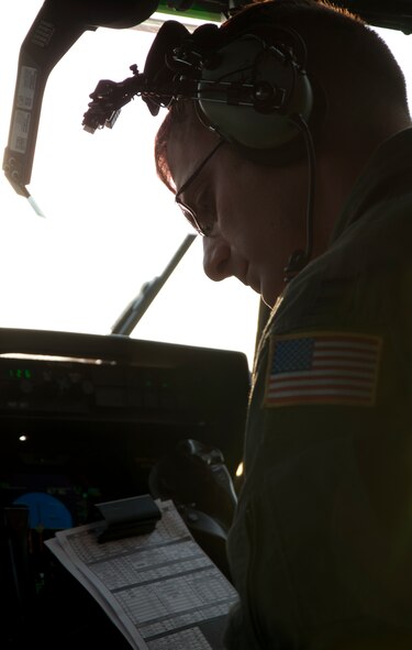 U.S. Air Force Capt. Peter Callo, 39th Airlift Squadron, Dyess Air Force Base, Texas, enters coordinates into a C-130J Super Hercules June 7, 2014, at Pope Army Airfield, Fort Bragg, N.C. The Joint Forcible Entry Exercise and Joint Airborne/ Air Transportability Training was a combined effort between the 317th Airlift Group and the 82nd Airborne Division from Ft. Bragg, N.C. (U.S. Air Force photo by Senior Airman Peter Thompson/Released)