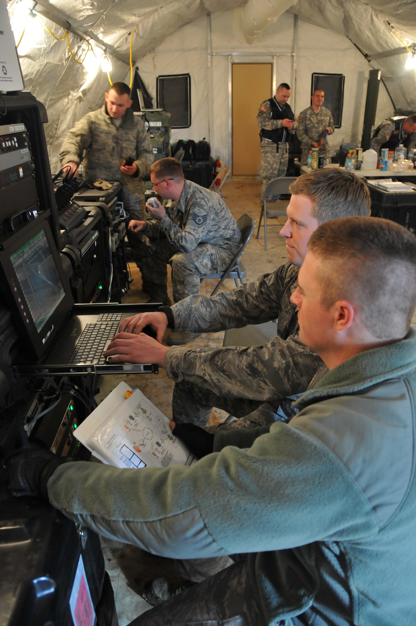269th Combat Communications Squadron control the radios and network capability at the 200th RED HORSE Detachment 1, Mansfield, OH, is hosting a Homeland Emergency Response Force exercise May 3, 2014. Ohio Army National Guard 73rd Troop Command out of Rickenbacker, Columbus, form most of the H.E.R.F team with support from the 179th Airlift Wing, 269th Combat Communications Squadron and the 125th Intelligence Squadron out of Springfield. The joint forces exercise prepares FEMA Region 5 for a quick response to any regional emergency that arises. (U.S. Air National Guard Photo by TSgt Joseph Harwood \Released)