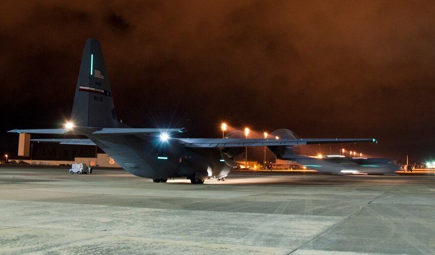 Two C-130J Super Hercules taxi to a runway June 5, 2014, at Pope Army Airfield, Fort Bragg, N.C. The Joint Forcible Entry Exercise and Joint Airborne/ Air Transportability Training was a combined effort between the 317th Airlift Group from Dyess Air Force Base, Texas, and the 82nd Airborne Division from Ft. Bragg, N.C. (U.S. Air Force photo by Senior Airman Peter Thompson/Released)