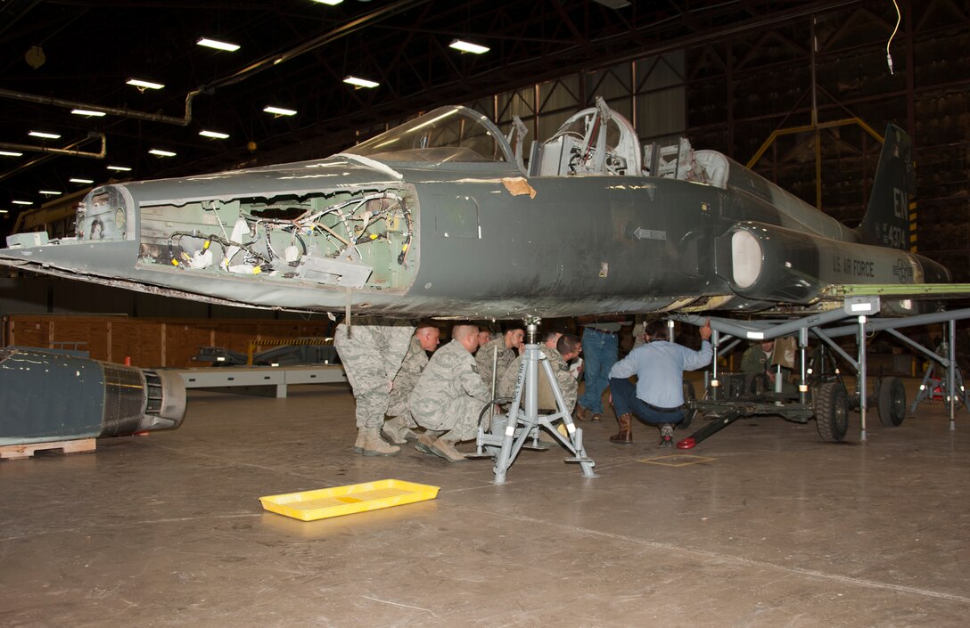 A T-38 Talon is in the process of being restored at Sheppard Air Force Base, Texas, and is scheduled to be displayed inside the newly expanded Wichita Falls Municipal Airport terminal by August 2014. One hundred percent of the restoration is being done by volunteers from several different career fields on the weekends and will consist of parts combined from damaged T-38's to repair one jet. (U.S. Air Force photo/Danny Webb)