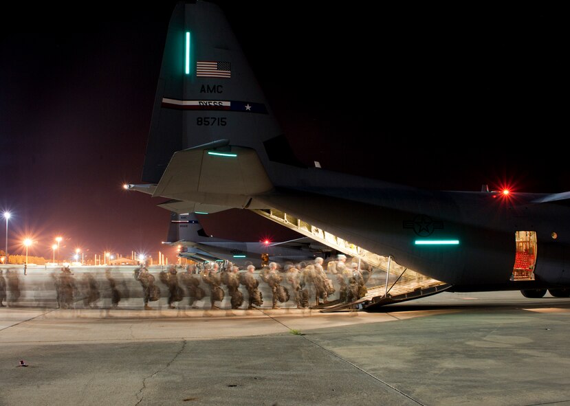Soldiers assigned to the 82nd Airborne Division load onto a 317th Airlift Group C-130J Super Hercules from Dyess Air Force Base, Texas, June 5, 2014, at Pope Army Airfield, Fort Bragg, N.C. The 317th AG transported nearly 1,500 soldiers and more than 57,000 pounds of equipment while supporting a Joint Forcible Entry Exercise and Joint Airborne/ Air Transportability Training.  (U.S. Air Force photo by Senior Airman Peter Thompson/Released)