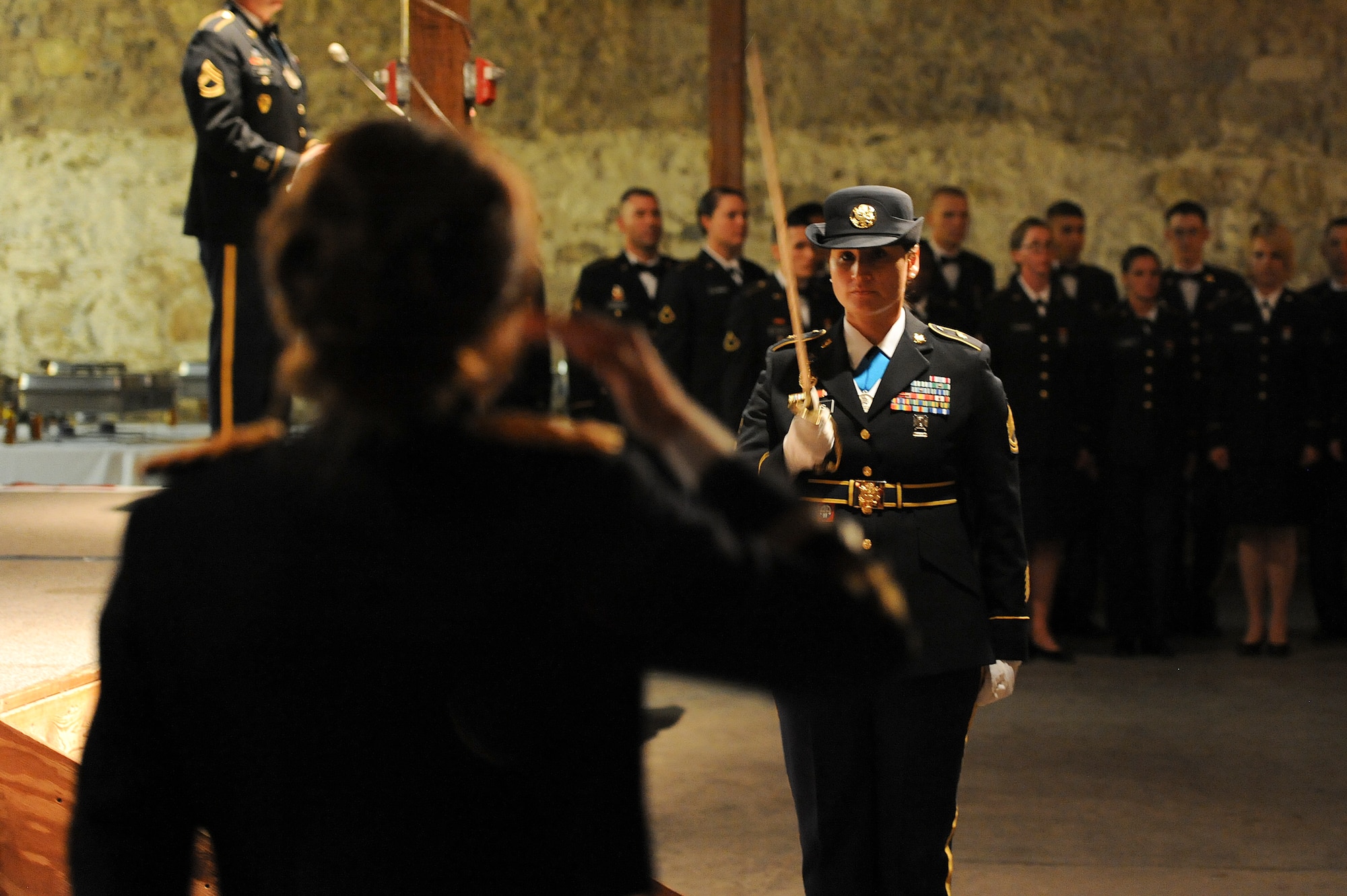 SAN ANGELO, Texas – Army Sgt. 1st Class Adriana A. Vargas, 344th Military Intelligence Battalion platoon sergeant, requests permission to post the colors during the Army Ball at Fort Concho Stables here June 6. The use of the NCO sword made this tradition unique since it is rarely used in ceremonies anymore. (U.S. Air Force photo/ Airman 1st Class Devin Boyer)