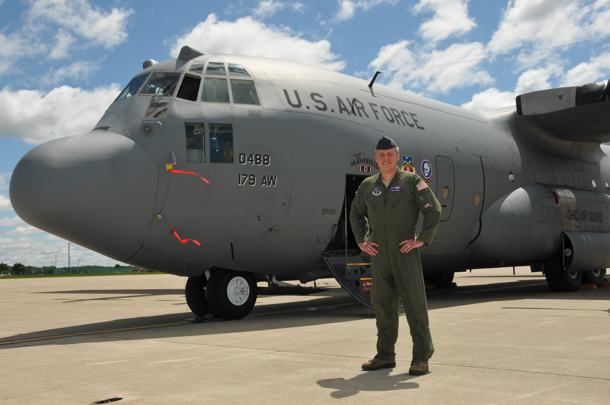 Members of the 179th Airlift Wing and various local media outlets welcome Capt. Mark Gongol into Mansfield, OH, June 5, 2014. Capt. Gongol has made international headlines for his heroic actions Dec. 30, 2013, when he helped to land a commercial 747 that he and his wife were travelling on when the pilot suffered a medical emergency. Capt. Gongol is transferring to the Ohio Air National Guard and will fly the C-130H Hercules with the 164th Airlift Squadron. (U.S. Air National Guard Photo by TSgt Joseph Harwood \Released)