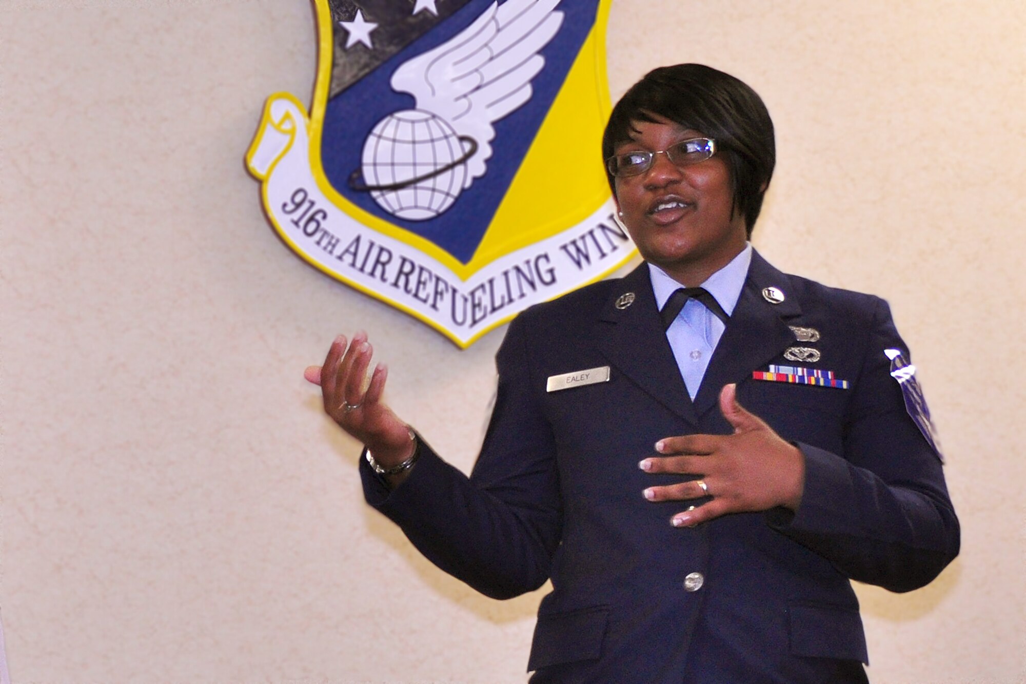 Tech. Sgt. Yasmine Ealey, 916th Air Refueling Wing Equal Opportunity advisor, speaks with attendees of her promotion ceremony held here over the June drill weekend. (USAF photo by Master Sgt. Wendy Lopedote, 916ARW/PA)