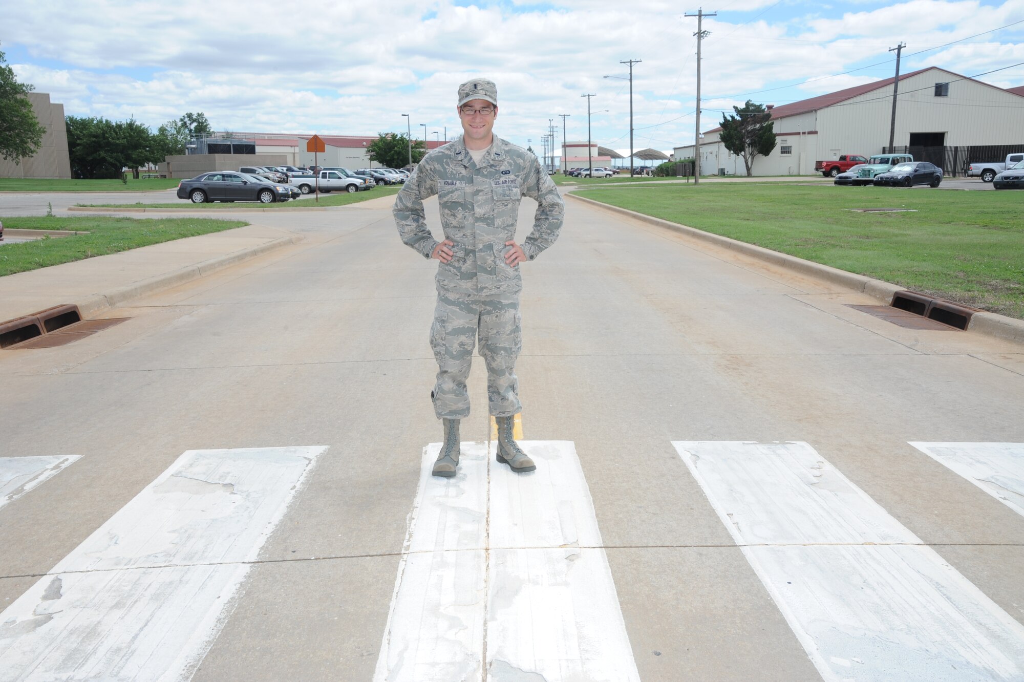 1st Lt. Dan Venable, a 71st Operations Support Squadron flight commander, stands on a crosswalk at Vance Air Force Base, Okla. Venable received the Dewitt Waller Middle School “Friend of Education” award May 22 for volunteering as a crossing guard for Dewitt Waller Middle School throughout the school year. (U.S. Air Force photo/Senior Airman Frank Casciotta)