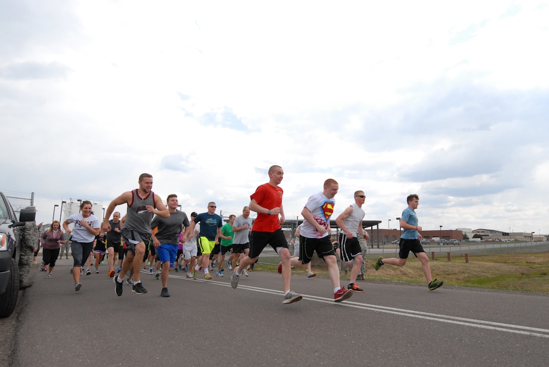 148th Fighter Wing members take off from the starting line while participating in the Fifth Annual 5K Meatball Run, 148th Fighter Wing, Duluth, Minn., May 18, 2014.  Most of the proceeds from the event go to support a local food bank in the Duluth, Minn. area, plus it gets members into the fitness frame of mind after a long winter.  (U.S. Air National Guard photo by Staff Sgt. Donald Acton/Released)