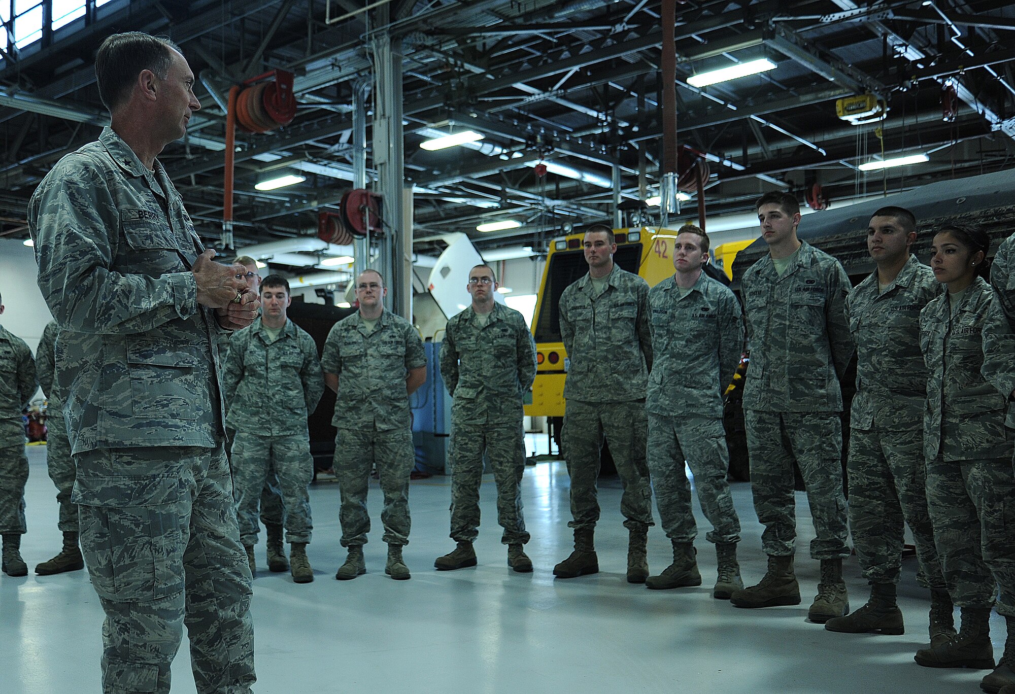 Brig. Gen. Warren D. Berry talks with Airmen from the 92nd Logistics Readiness Squadron during his tour at Fairchild Air Force Base, Wash., June 10, 2014. During Berry’s visit to Team Fairchild, he was briefed on the maintenance and logistic squadrons’ mission. Berry is the Air Mobility Command director of logistics. (U.S. Air Force photo by Staff Sgt. Samantha Krolikowski/Released)