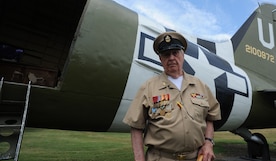 Retired Navy Chief Petty Officer Arlington Sandford, stands in front of a C-47 Skytrain during a visit on June 6, 2014, in honor of the 70th Anniversary of D-Day at Joint Base Charleston, S.C. Sandford served during D-Day.  (U.S. Air Force photo/ Staff Sgt. William A. O’Brien)