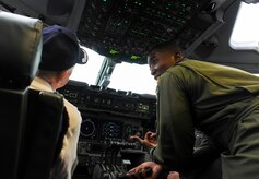 Capt. Jared Baxley, 16th Airlift Squadron pilot, gives Retired Army Air Force Don Wallace, a C-47 Skytrain pilot, United States Air Force C-47 Skytrain pilot, a tour of the cockpit of a C-17. Wallace was at Joint Base Charleston in honor of the 70th Anniversary of D-Day. (U.S. Air Force photo/ Staff Sgt. William A. O’Brien) 