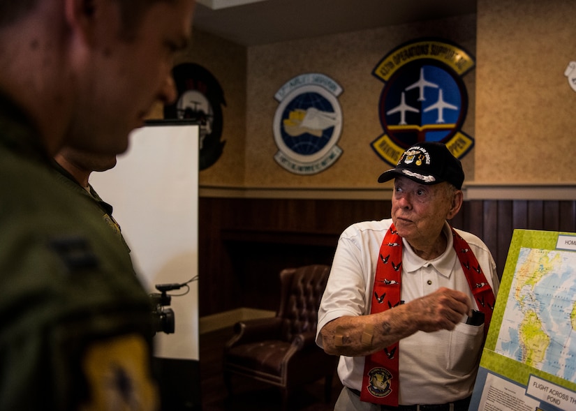 Retired Army Air Force Lt. Col. Don Wallace, a C-47 Skytrain pilot, points out the route he flew during the war, to 437th Airlift Wing Airmen. Wallace was at Joint Base Charleston in honor of the 70th Anniversary of D-Day. (U.S. Air Force photo/ Senior Airman Dennis Sloan)