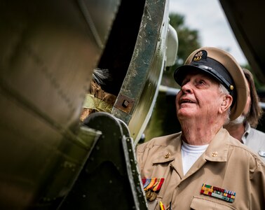 Retired Navy Chief Petty Officer Arlington Sandford, looks inside the C-47 Skytrain during a visit June 6, 2014, in honor of the 70th Anniversary of D-Day at Joint Base Charleston, S.C. Sandford worked in the engine room aboard a landing craft ship as well as a 20mm gunner. (U.S. Air Force photo/ Senior Airman Dennis Sloan)