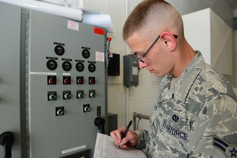 U.S. Air Force Airman 1st Class Michael Wanless, 633rd Civil Engineer Squadron Water, Fuel and System Maintenance, performs a daily inspection of a plumbing vacuum system at Langley Air Force Base, Va., June 10, 2014. Wanless has been on station for seven months and is a native of Bloomington, Illinois. (U.S. Air Force Staff Sgt. Stephanie R. Plichta/Release) 