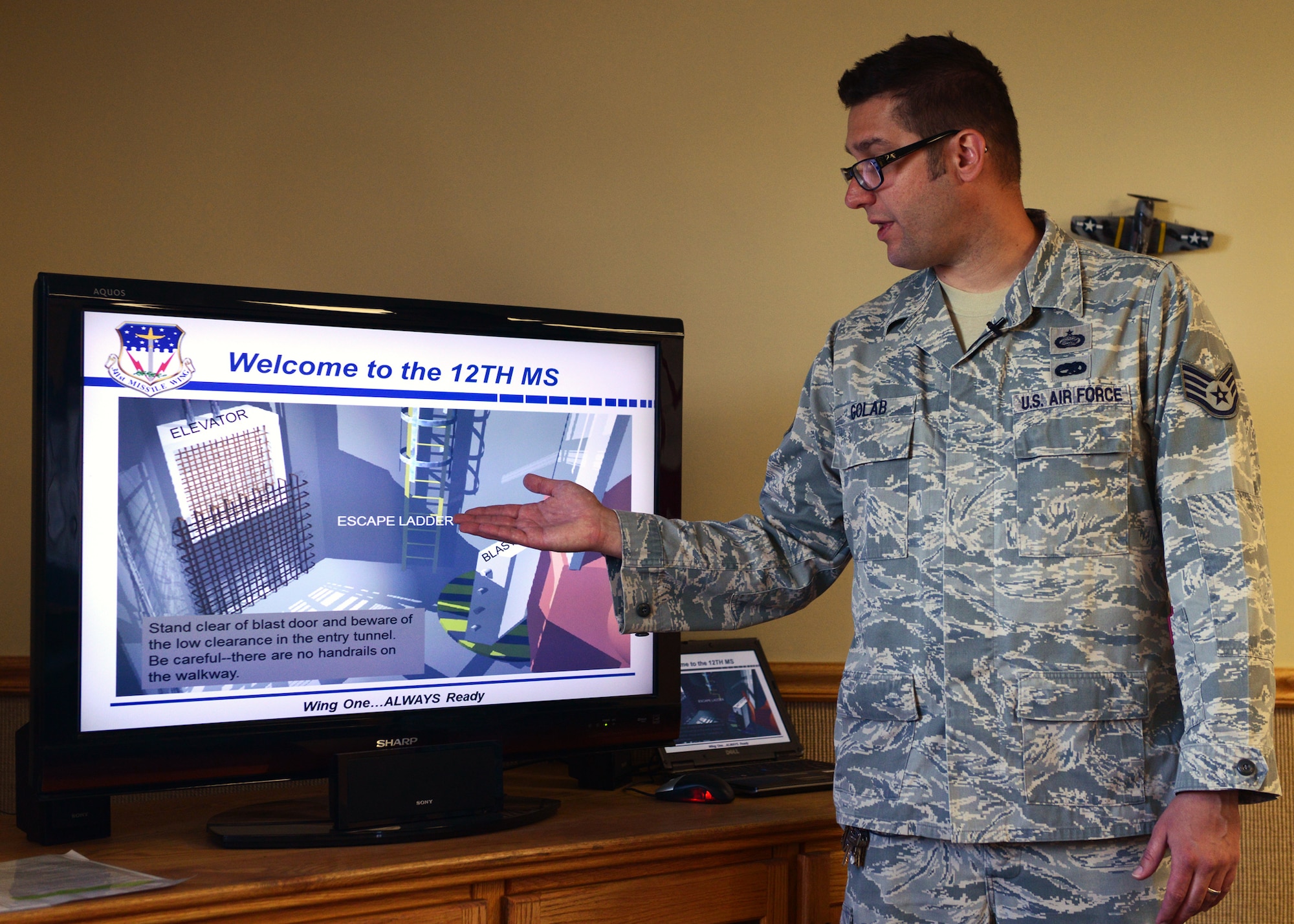 Staff Sgt. David Golab, 12th Missile Squadron facility manager, gives a safety brief at India 1 missile alert facility. Safety briefs are required to be given every time a guest visits a MAF in order to prevent injury in dangerous conditions and to illustrate how a MAF performs its daily operations.  (U.S. Air Force photo/Senior Airman Katrina Heikkinen)