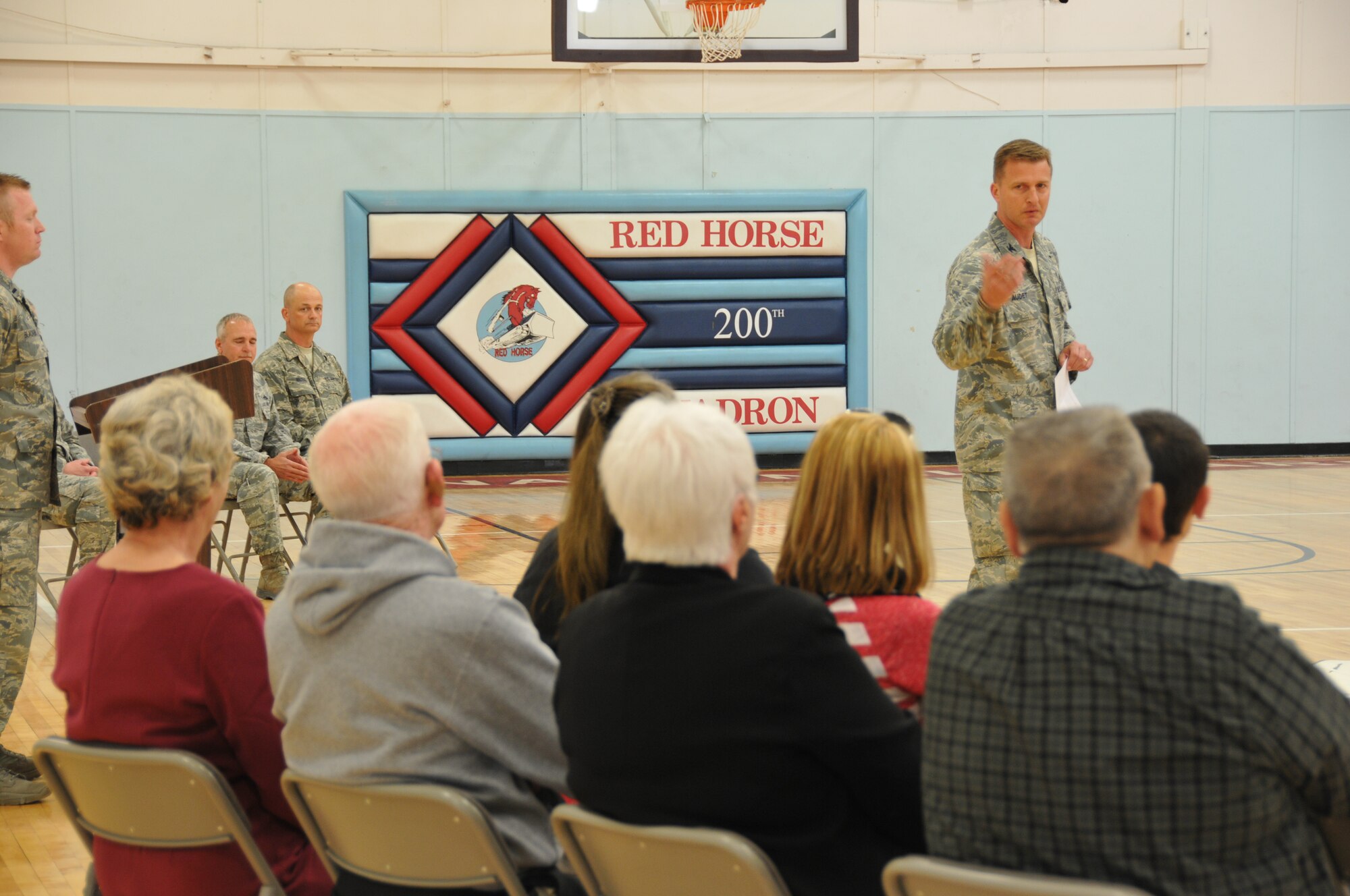 Colonel Todd M. Audet, 200th RED HORSE Commander, welcomes the family of Technical Sergeant Daryl A. Walters of the Ohio Air National Guard's 200th RED HORSE Squadron, who being is decorated with the Ohio Distinguished Service Medal, Camp Perry, OH, May 4, 2014. Major General Mark E. Bartman, Ohio's Assistant Adjutant General-Air, presents Tech. Sgt. Walters with the medal and speaks highly of the value of military training and experience in our communities. The Ohio National Guard Distinguished Service Medal is the second highest medal for heroism awarded by the state. (U.S. Air National Guard photo by Technical Sergeant Joe Harwood/Released)