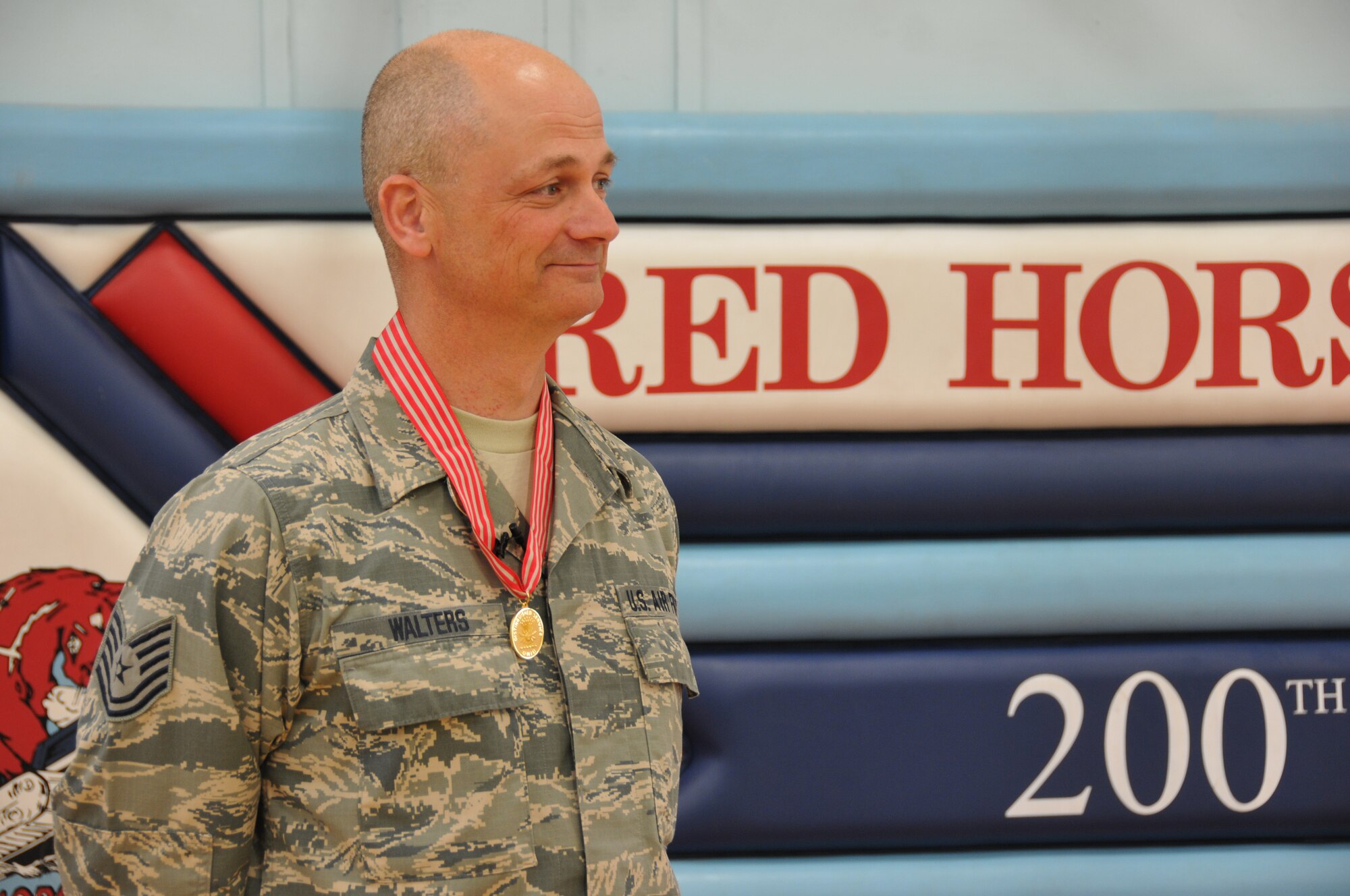 Technical Sergeant Daryl A. Walters of the Ohio Air National Guard's 200th RED HORSE Squadron is decorated with the Ohio Distinguished Service Medal, Camp Perry, OH, May 4, 2014. Major General Mark E. Bartman, Ohio's Assistant Adjutant General-Air, presents Tech. Sgt. Walters with the medal and speaks highly of the value of military training and experience in our communities. The Ohio National Guard Distinguished Service Medal is the second highest medal for heroism awarded by the state. (U.S. Air National Guard photo by Technical Sergeant Joe Harwood/Released)