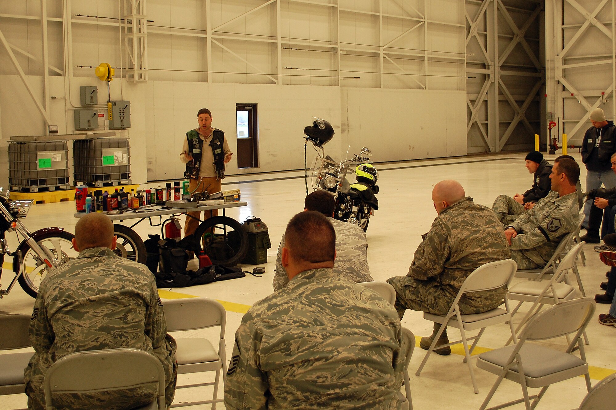 Staff Sgt. Joshua Borushko, 62nd Aircraft Maintenance Squadron motorcycle safety representative, explains how to winterize a motorcycle during a Winterization seminar Nov. 26, 2013, at Joint Base Lewis-McChord, Wash. This year’s Springerization Seminar was hosted by the 62nd Maintenance Squadron’s motorcycle safety representatives to help Team McChord riders prepare their motorcycles for the summer months. (U.S. Air Force photo/Tech. Sgt. Justin Babb)   