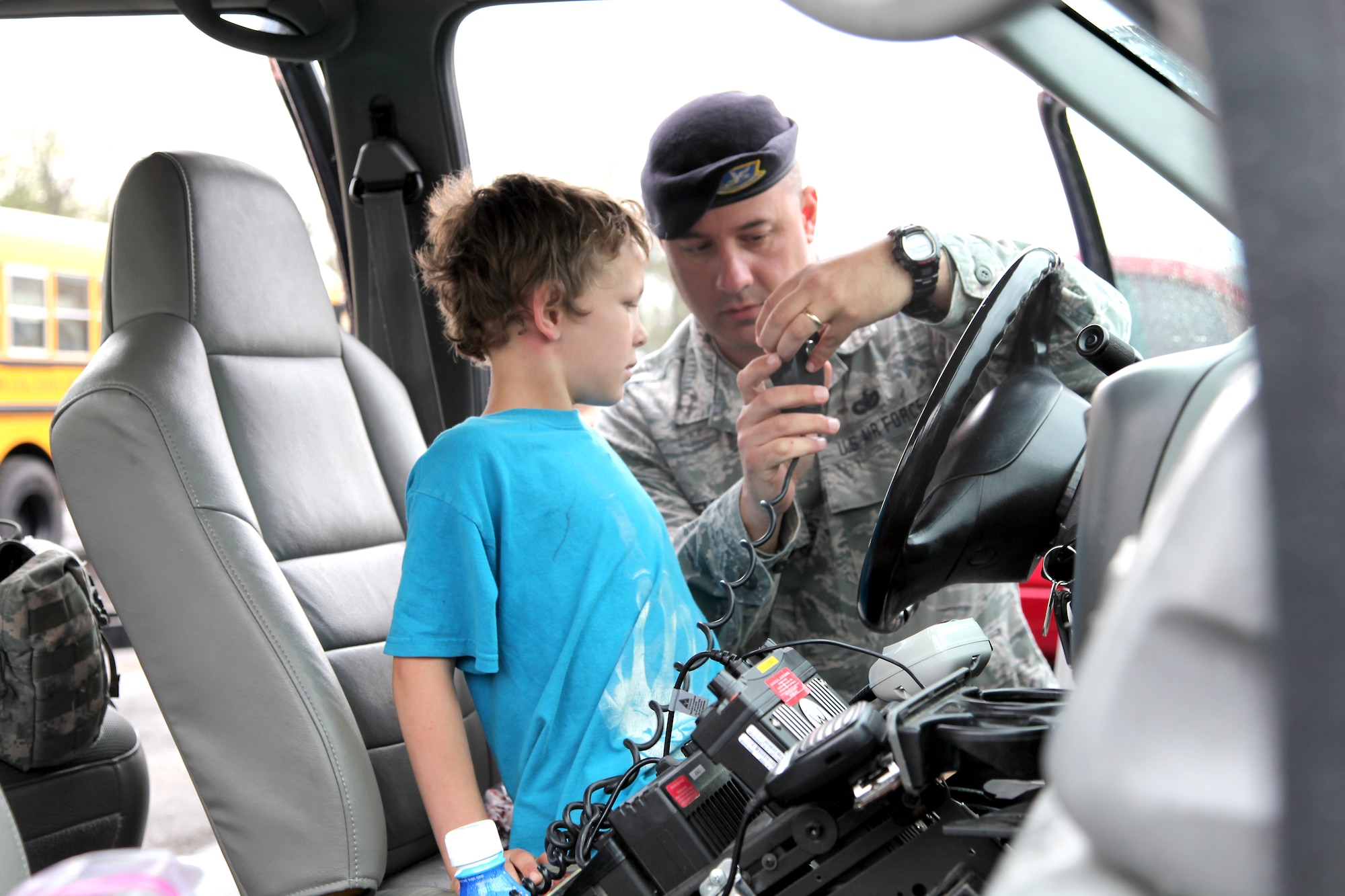 179 Security Forces troops enjoy “Touch a Truck” day with the students at Madison South Elementary school, Mansfield, Ohio, May 9, 2014. Tech. Sgt. Brandon Velemirov and Staff Sgt. Michelle Roark from 179th Security Forces Squadron volunteered to take a Security Forces vehicle to Madison South Elementary school for the afternoon. TSgt Velemirov and SSgt Roark gave the kids a taste of what it’s like to be in the military and military police.(U.S. Air National Guard Photo by MSgt Lisa Haun \Released)