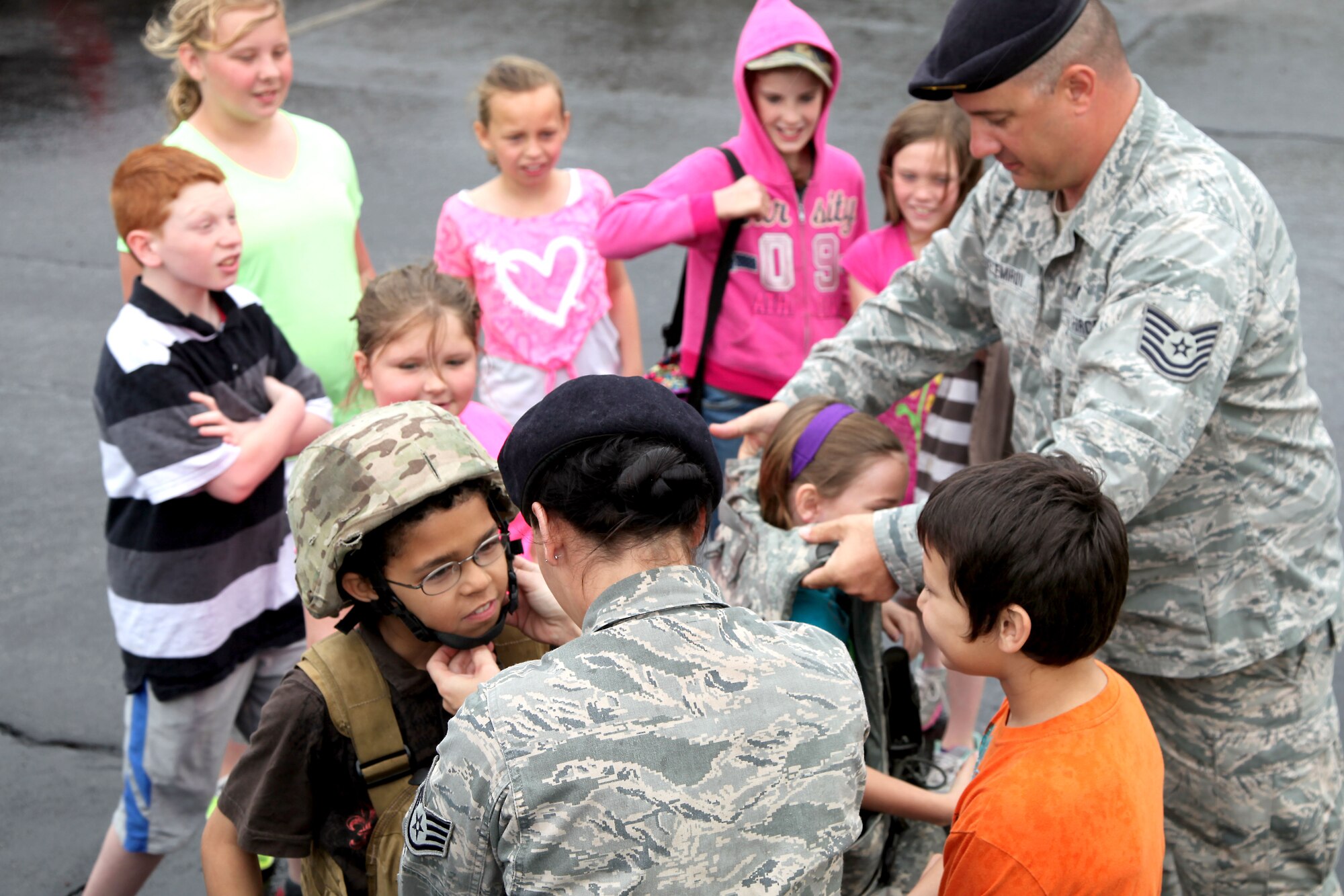 179 Security Forces troops enjoy “Touch a Truck” day with the students at Madison South Elementary school, Mansfield, Ohio, May 9, 2014. Tech. Sgt. Brandon Velemirov and Staff Sgt. Michelle Roark from 179th Security Forces Squadron volunteered to take a Security Forces vehicle to Madison South Elementary school for the afternoon. TSgt Velemirov and SSgt Roark gave the kids a taste of what it’s like to be in the military and military police.(U.S. Air National Guard Photo by MSgt Lisa Haun \Released)