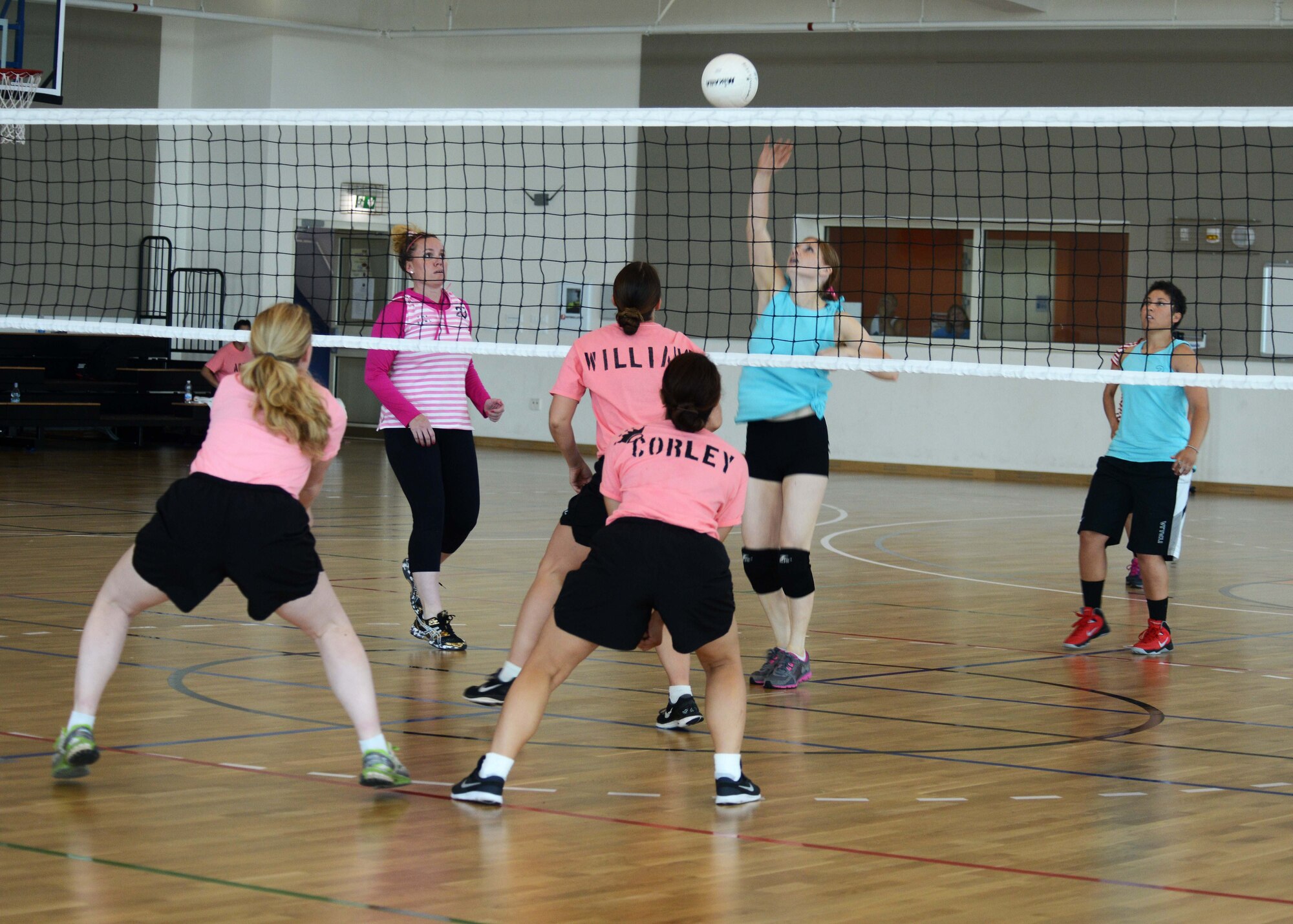 Members of the Aviano Air Base’s “Single Airmen Staying Strong” and U.S. Army Garrison Vicenza’s “Female to Female” groups compete in a game of volleyball during a “Pink Bowl” event, June 6, 2014, at U.S. Army Garrison Vicenza, Italy. The Pink Bowl brought Air Force and Army females together to strengthen bonds between branches and help each other understand their separate missions. (U.S. Air Force photo/Airman 1st Class Abbey Whittaker)
