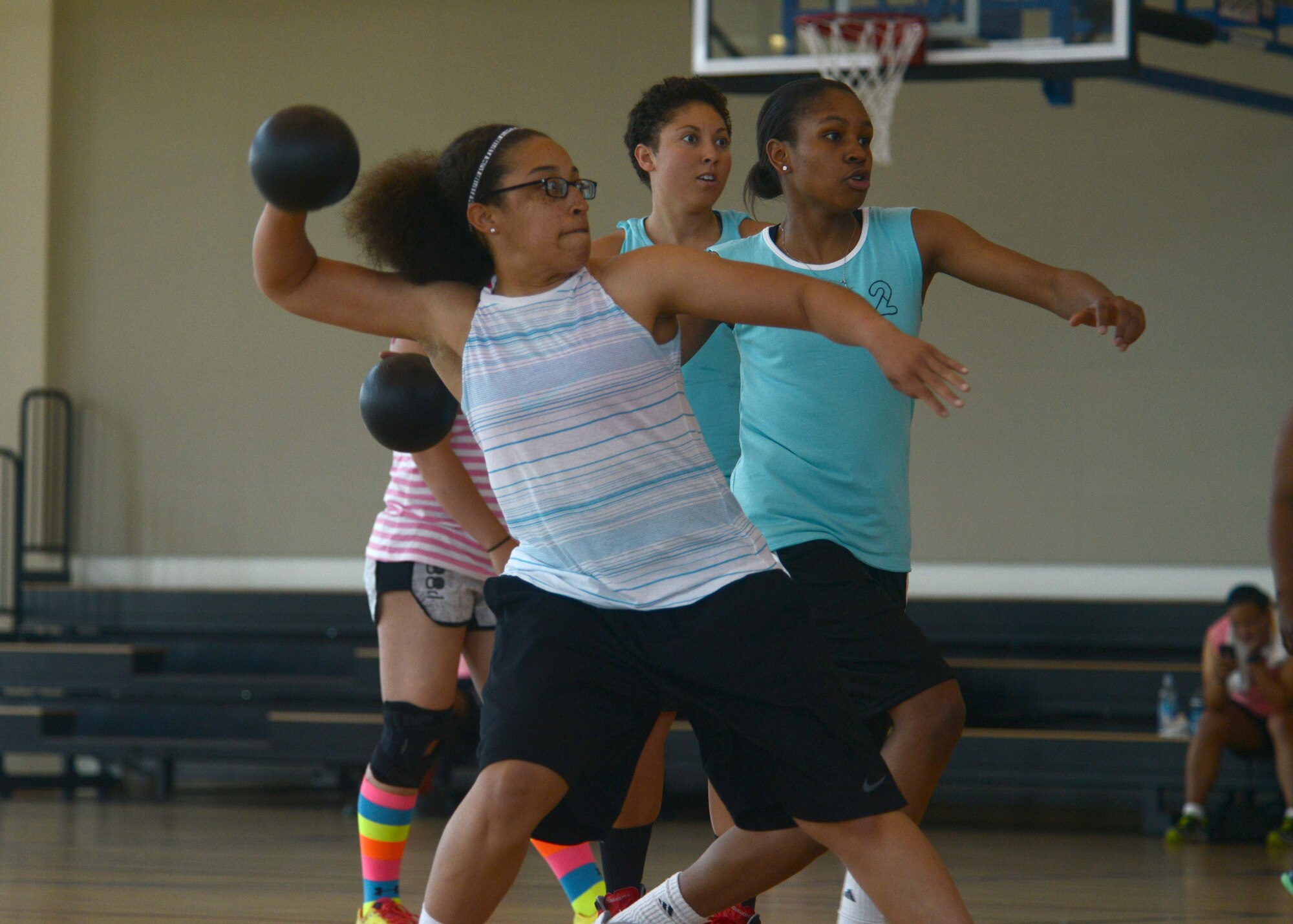 Senior Airman Akia Carter, 31st Communications Squadron, throws a ball during a game of dodge ball between Aviano and Vicenza service members, June, 6, 2014, at U.S. Army Garrison Vicenza, Italy.  The first ever “Pink Bowl” competition was an opportunity for Airman and Soldiers to come together through teamwork and competition. (U.S. Air Force photo/Airman 1st Class Deana Heitzman) 