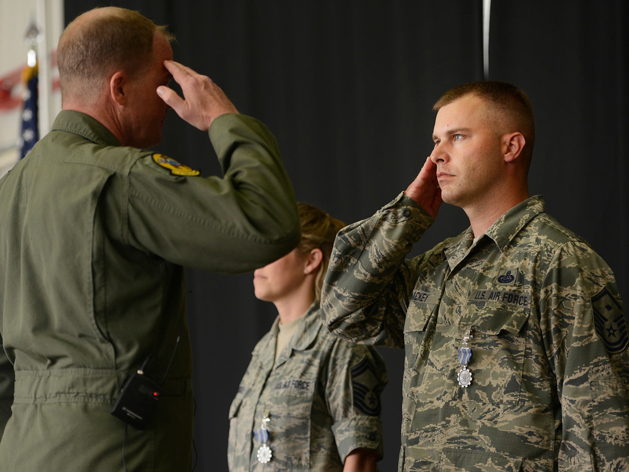 Colonel David B. Burgy, 138th Fighter Wing Commander, presents the U.S. Air Force Achievement Medal to 1st Sergeant John Mackey for his outstanding work as a Family Assistance Officer.  The medal was presented during a Commanders Call at the Tulsa Air National Guard base, June 8, 2014.    (U.S. National Guard photo by Master Sgt.  Mark A. Moore/Released)