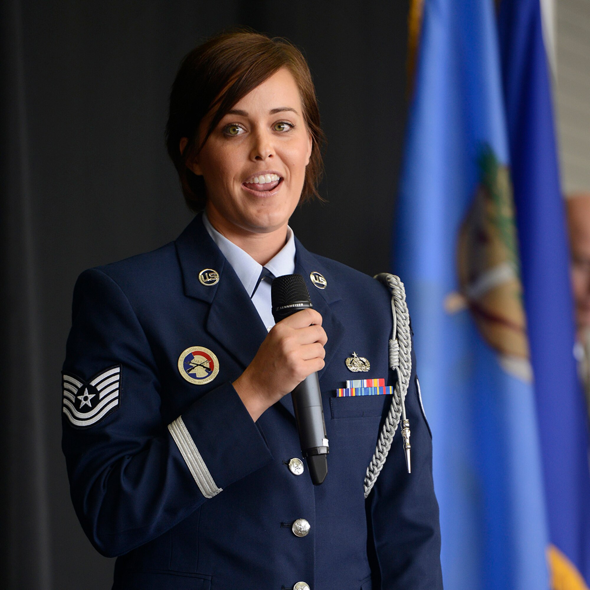 Technical Sergeant Jennifer Carson speaks to personnel of the 138th Fighter Wing during a Commanders Call at the Tulsa Air National Guard base, June 8, 2014.  Carson is an active member of the 138th Honor Guard which is currently seeking to recruit new members.   (U.S. National Guard photo by Master Sgt.  Mark A. Moore/Released)