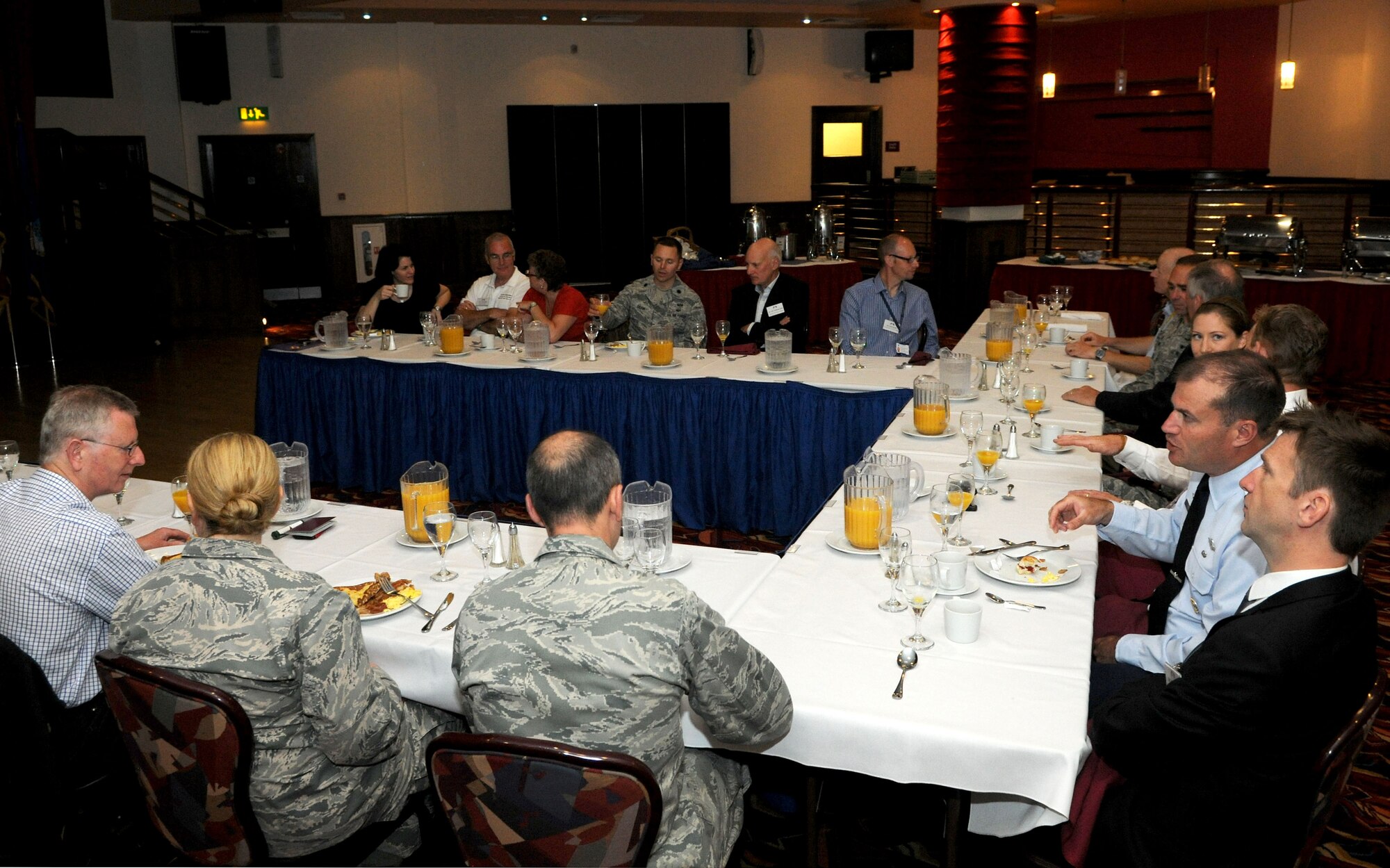 Leadership from the 100th Air Refueling Wing and representatives from local off-base businesses meet for a business breakfast June 10, 2014, in the Galaxy Club on RAF Mildenhall, England. The visit consisted of an intimate breakfast with commanders to facilitate networking, followed by a short tour of the base and a KC-135 Stratotanker static display to better communicate the mission and purpose of RAF Mildenhall. (U.S. Air Force photo/Senior Airman Kate Maurer/Released) 