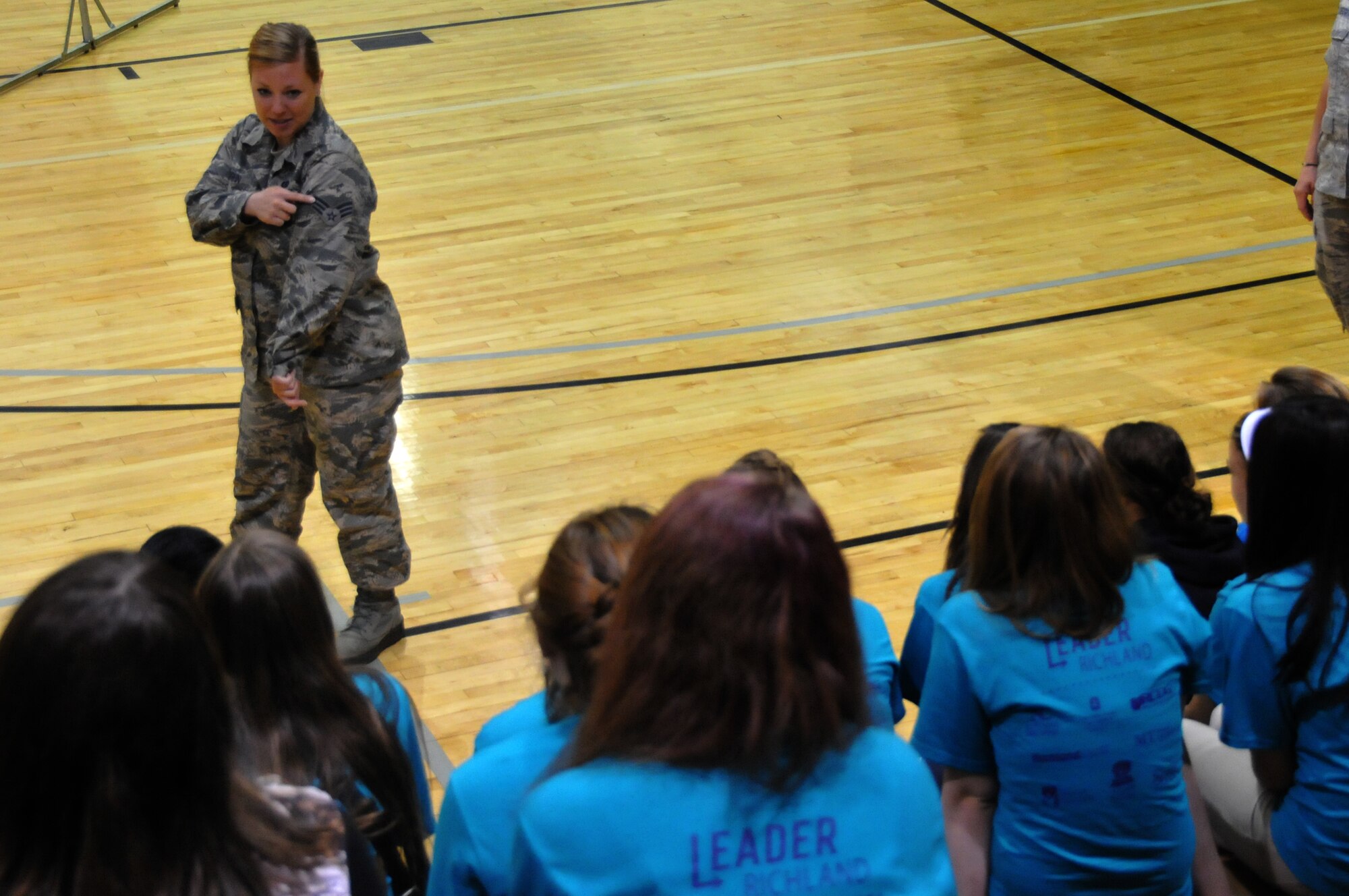 Senior Airman Casey Vaughn speaks to girls about her experience in the Air National Guard as the 179th Airlift Wing and 200th RED HORSE Det. 1 particpate in the Leader Richland event at Ohio State Mansfield/North Central State College campus, Mansfield, OH, May 15, 2014. The program is by the Richland Community Development Group and aims to inspire 7th and 8th graders to reach their full potential as future community leaders. (U.S. Air National Guard photo by Technical Sergeant Joe Harwood/Released)