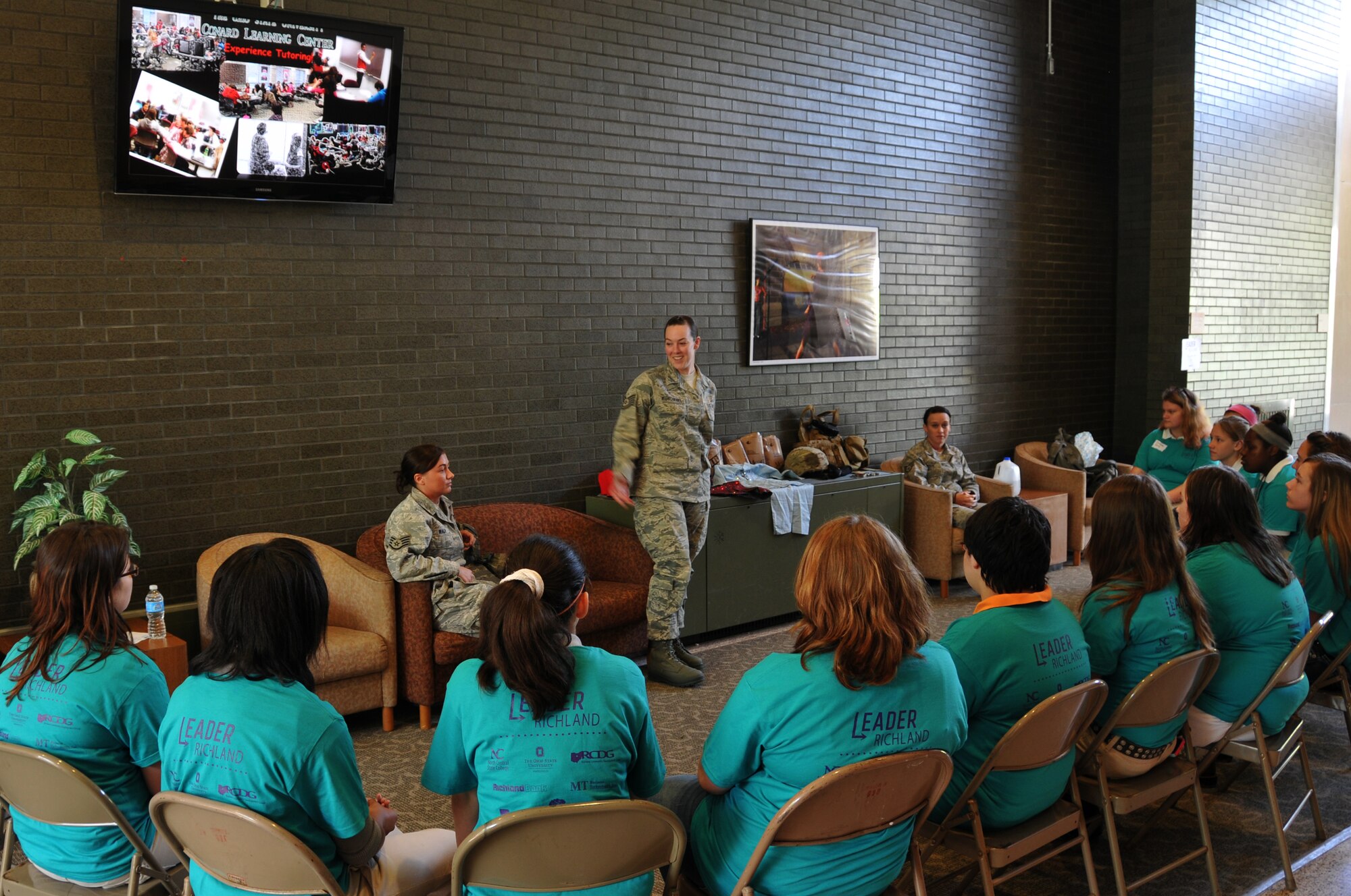 Tech. Sgt. Rebecca Neunschwander speaks to girls about her experience in the Air National Guard as the 179th Airlift Wing and 200th RED HORSE Det. 1 particpate in the Leader Richland event at Ohio State Mansfield/North Central State College campus, Mansfield, OH, May 22, 2014. The program is by the Richland Community Development Group and aims to inspire 7th and 8th graders to reach their full potential as future community leaders. (U.S. Air National Guard photo by Technical Sergeant Joe Harwood/Released)