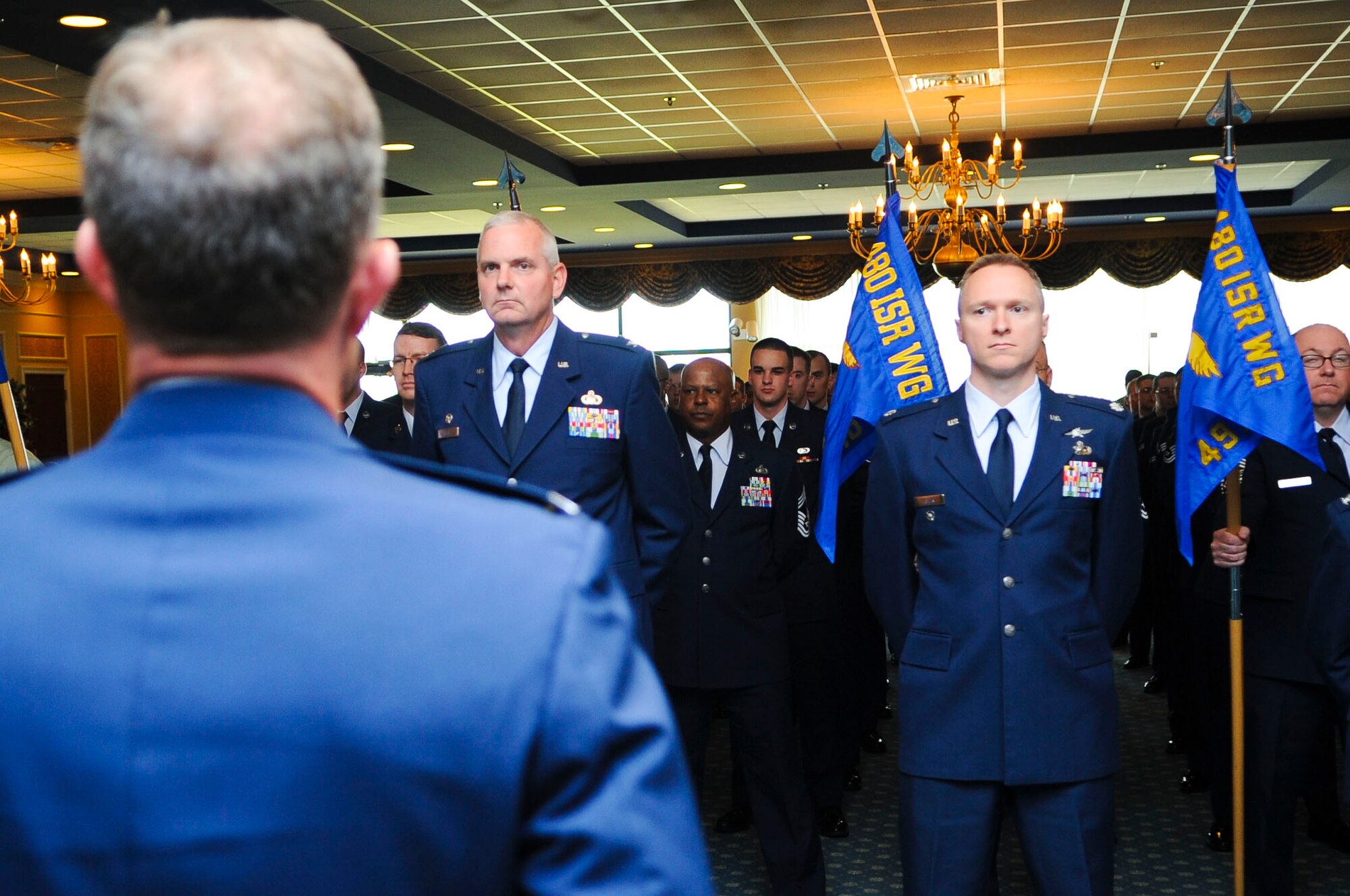 U.S. Air Force Airmen from the 480th Intelligence, Surveillance and Reconnaissance Wing stand in formation during the 480th ISR Wing change of command ceremony at Langley Air Force Base, Va., June 6, 2014. Colonel Jeff Hinrichs commanded the troops during the ceremony. (U.S. Air Force photo by Senior Airman Austin Harvill/Released)